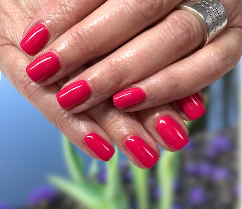 Shellac nails hands with beautiful red Shellac nails
